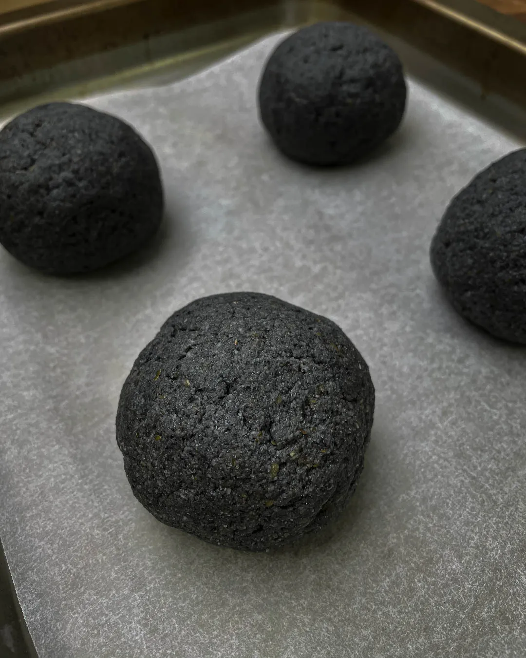 Dough balls on baking sheet